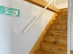 Stairs to the attic where you`ll find an ocean theme and sleeping accommodations for up to 4